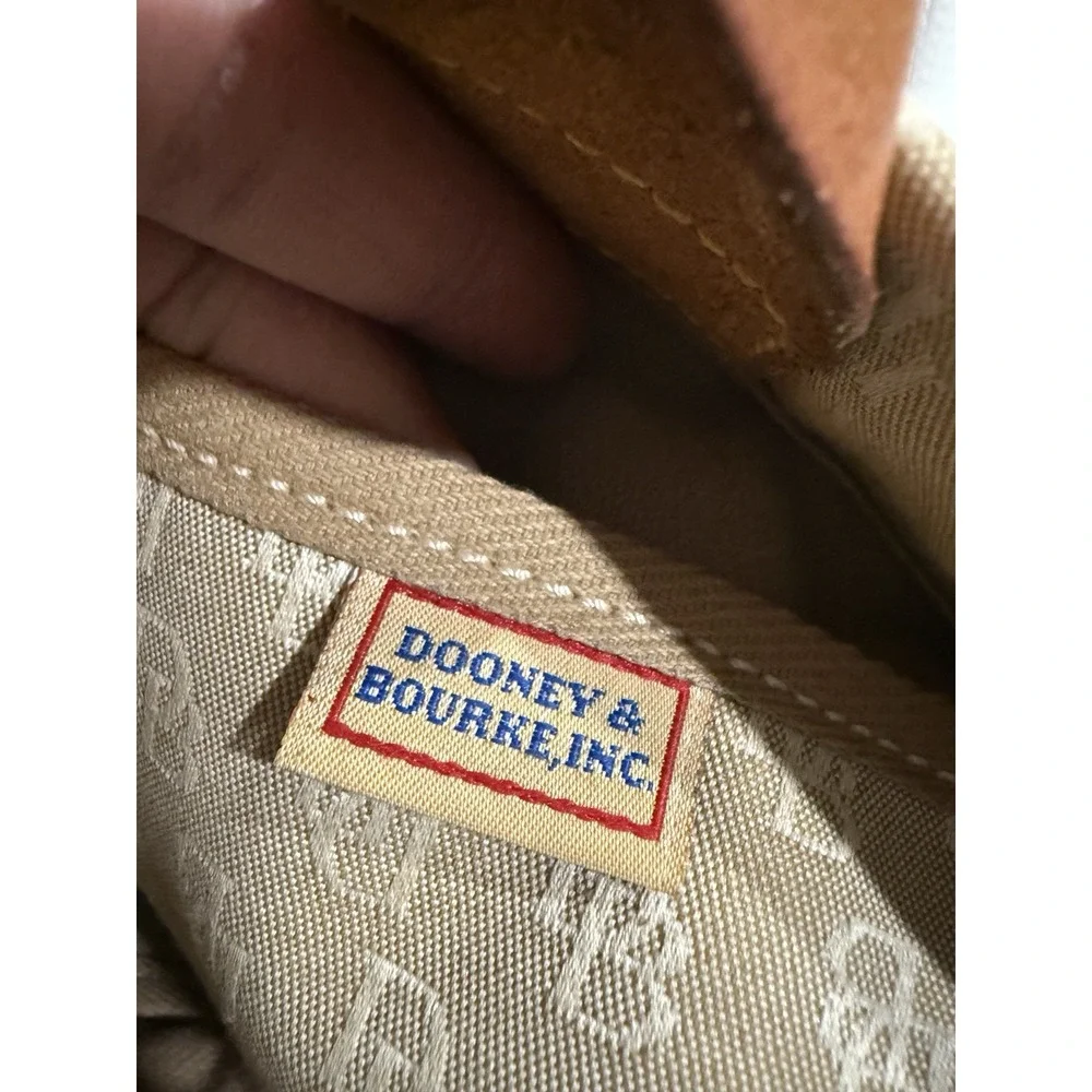 Dooney and Bourke Beige Canvas and Leather Signature Tassel Tote Handbag‎